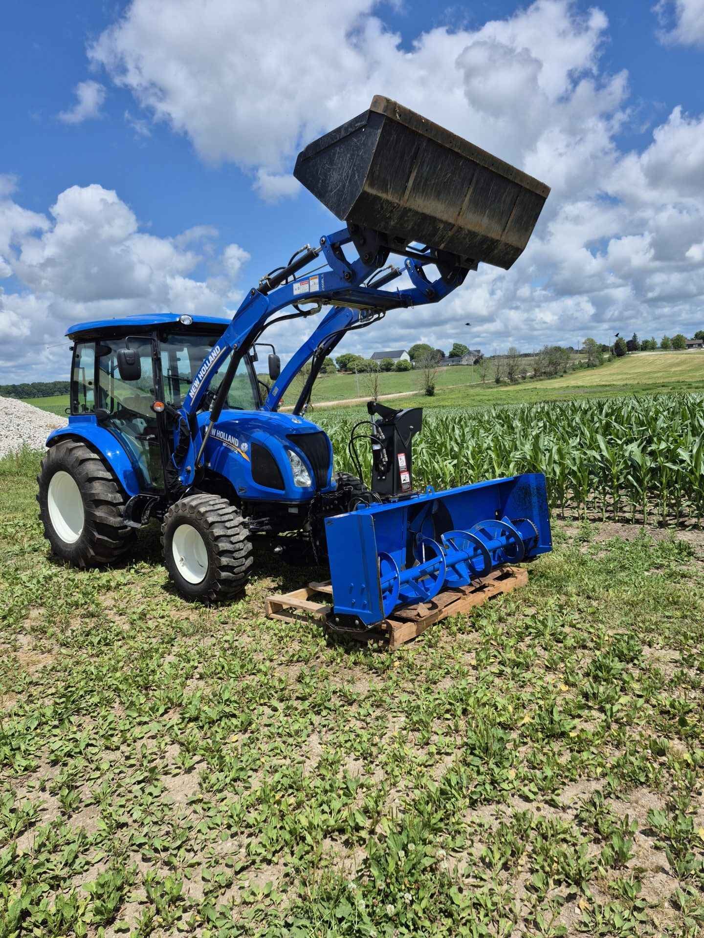 New Holland boomer 55 4x4 excellent condition comes with 74 front mount snowblower attatchment loader and bucket it has Bluetooth stereo all the lights work still has the plastic on the seat equipped with heat and A/C