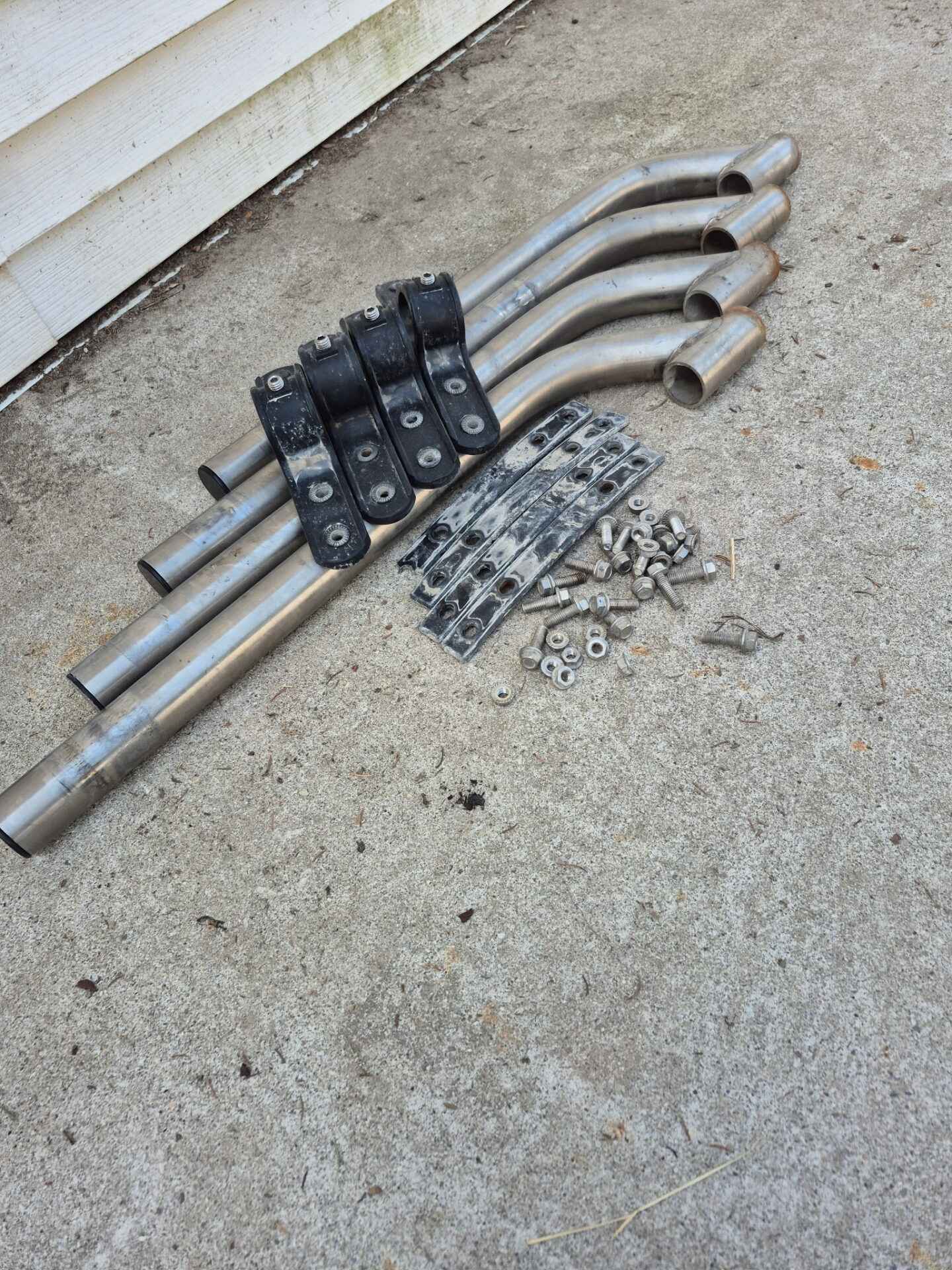 Set of stainless fender hanger arms with assorted hardware