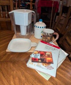 Cookbooks, cutting board, mugs, pitcher etc