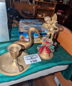 Brass bell, bird statue and candle stick holder