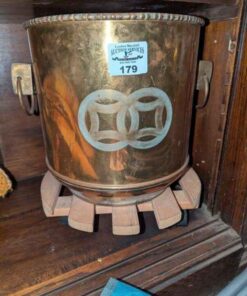 Brass planter and wooden roller