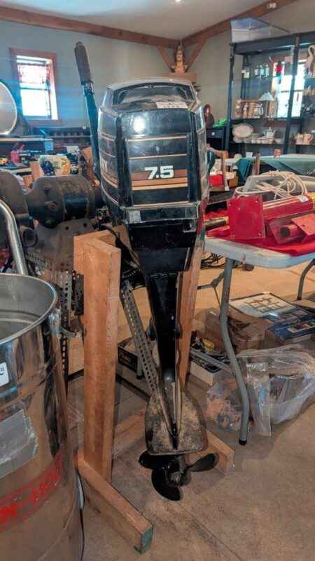 7.5 HP Mercury outboard motor with stand