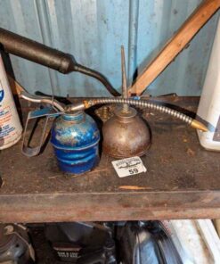 Eagle and unmarked oil cans