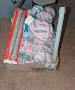 Skeins of yarn and US25 Knitting needles