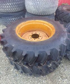 Pair of 13.6 24 tires on 8 bolt wheels