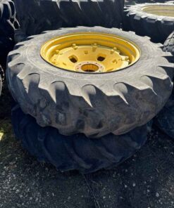 Pair of 14.9 28 tires on Jd 8 bolt wheels