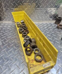 Long yellow parts tray with assorted bushings etc