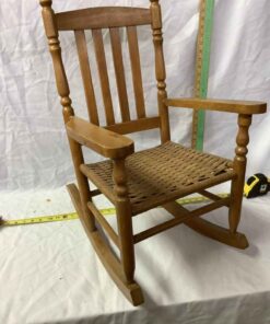 Child's wooden rocker with rattan seat