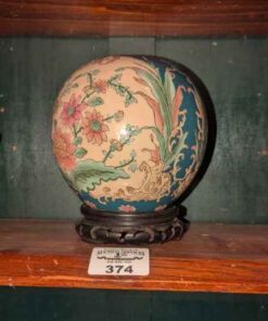 Decorative globe vase on stand