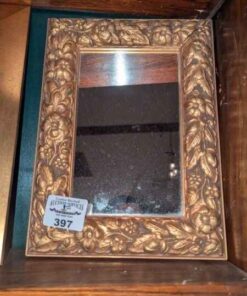 Wall mirror with decorative frame
