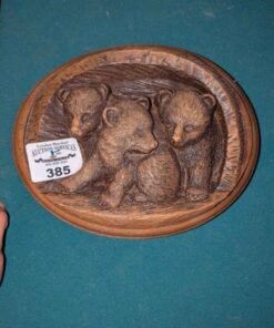 Relief carved bear cub wall plaque
