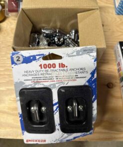 Box of wheel nuts and anchors