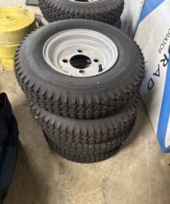 Unused 4.80/4.00-8 tires on 4 bolt wheels quantity of four