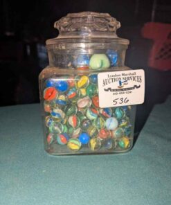 Clear glass jar of marbles