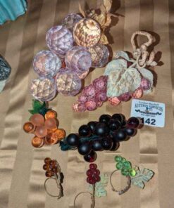 Glass and assorted artificial grapes