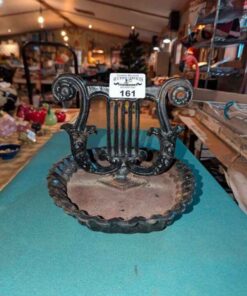 Antique Cast Iron Lyre shaped boot scraper with ruffle edged mud tray