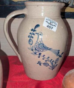 Stoneware pitcher with cobalt blue bird design