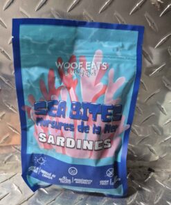 Wolf eats sea bites sardines