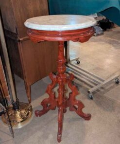 Marble top stand with ornate Wooden base