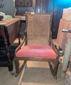 Cane back wooden rocking chair