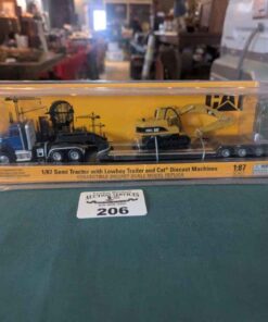 CAT 1;87 scale model Semi Tractor with lowboy trailer & Cat Diecast machine