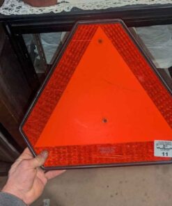 Slow moving vehicle caution sign