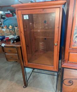 Glass single door cabinet on wrought iron stand