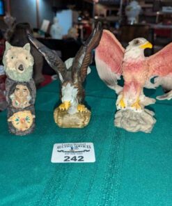 Eagle and totem pole statues