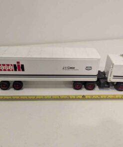 1/32 scale metal truck branded CaseIH with J I Case - A Tenneco Company on the trailer