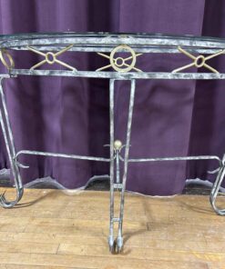 114 - Glass and Wrought iron side table.