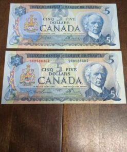 2  1972 lightly circulated Canada 5 dollar bills.