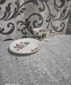 cup and saucer with flowers