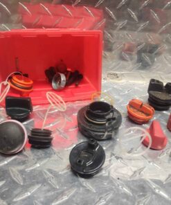 Assorted fuel and oil caps with red parts bin