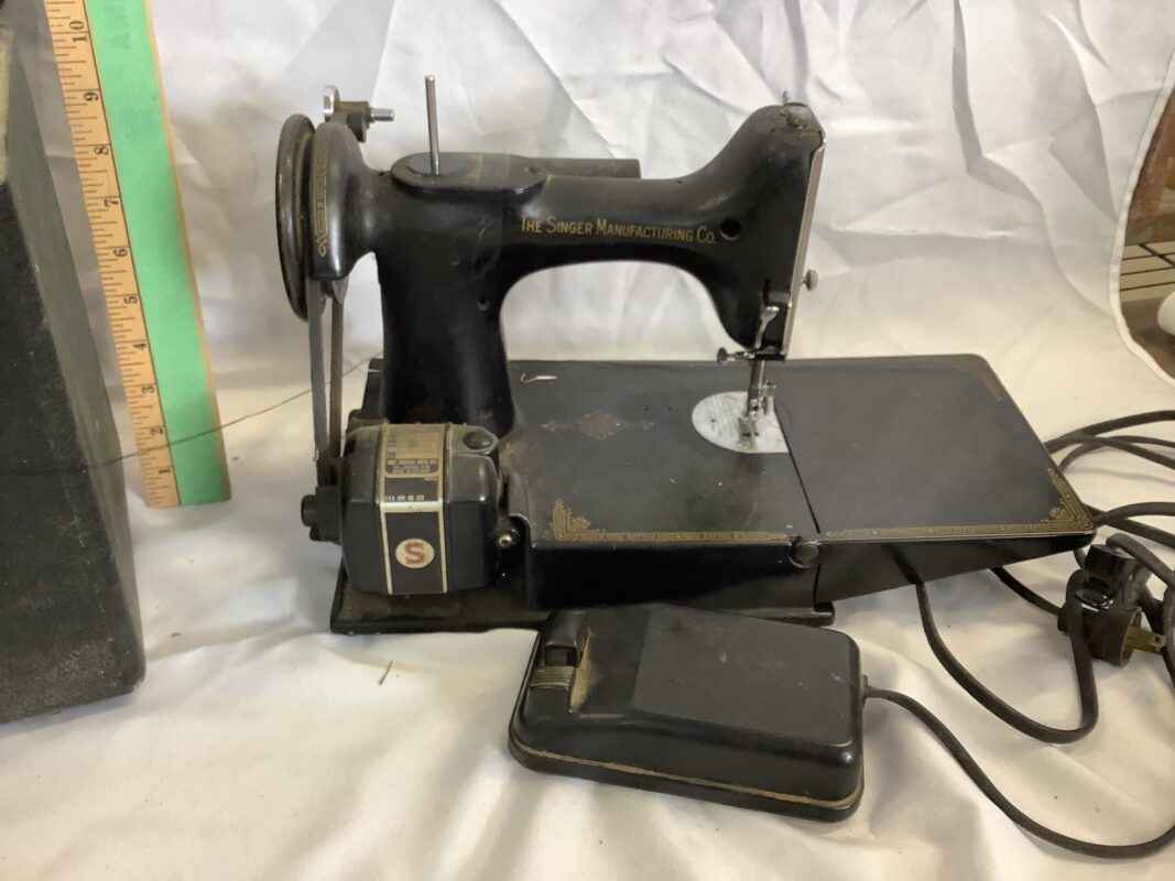 The Singer Manufacturing Co. Featherweight Portable Sewing Machine