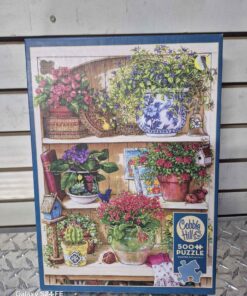 500 piece cobble Hills puzzle... open box