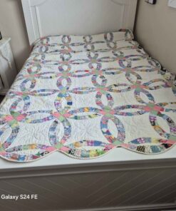 Queen sized or larger multi colors with white background patchwork quilt