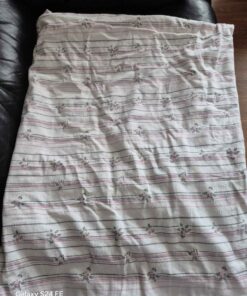 enclosed bed sheet with sprigs of flowers