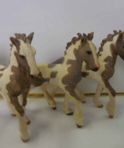 A group of paint foals with one appaloosa foal (resin figurines)