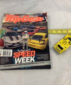 Race car magazine & a Corgi toy Porsche 956 sell together