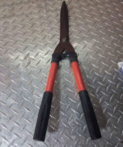 Hedge clipper with orange and black handle
