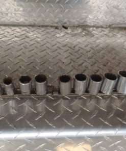 11 piece craftsman and more sockets on metal holder 1/2 drive