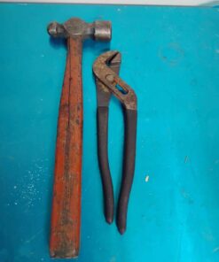Ball pein hammer and channel lock style pliers