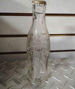 Vintage Coca-Cola bottle with raised writing