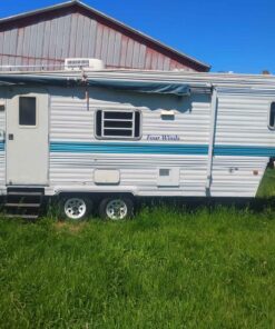 5 wheel hitch motor home....has water damage at the rear excellent for on the farm or back in the woods camping cabin