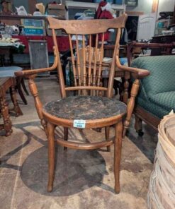 Antique chair with leather seat cover
