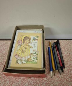 27 assorted cards and pens and pencils