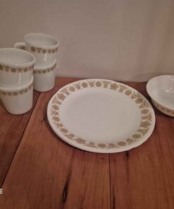 4 coffee mugs with matching bowl and plates