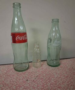 2 coke bottles plus 1 other