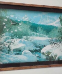 Snowy morning in the mountains clock