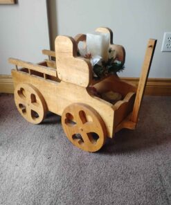 Festive wooden buggy plant and candle stand